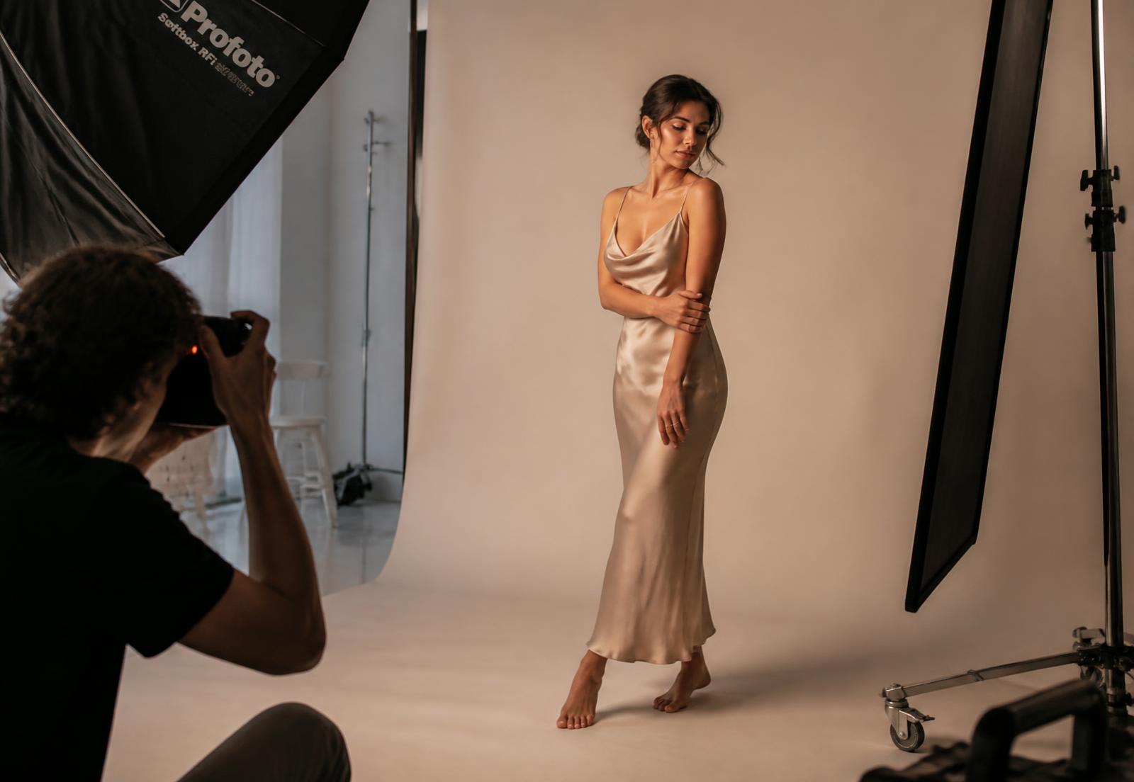 Studio photoshoot on a cream backdrop with professional lighting